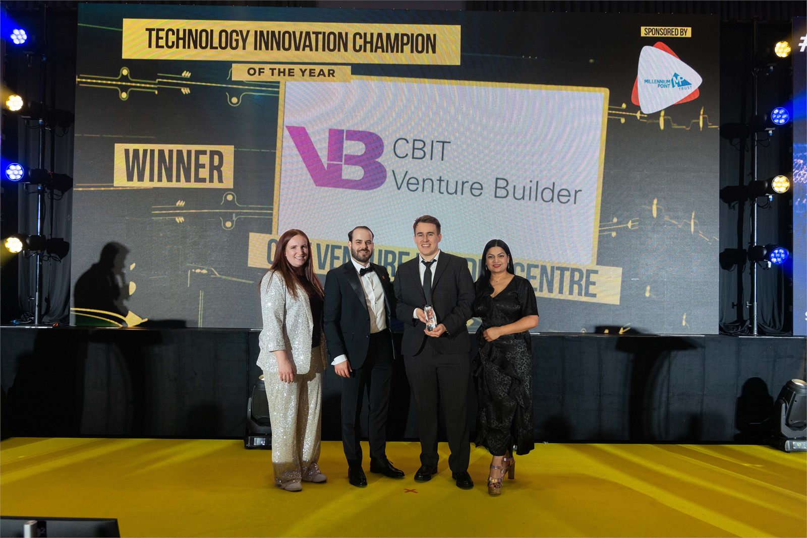 The CBIT Venture Builder team on stage receiving the Technology Innovation Champion award, 2024