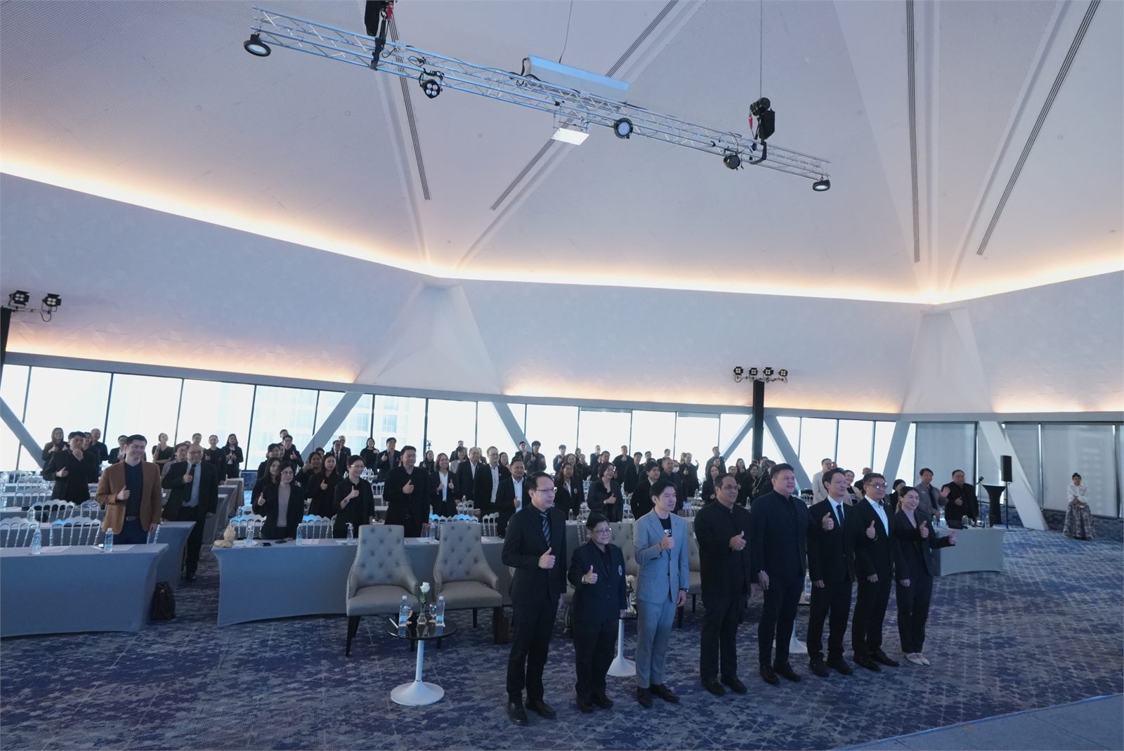 Delegates at the Thai AI Conference 2025 standing for a group photograph in a large conference hall